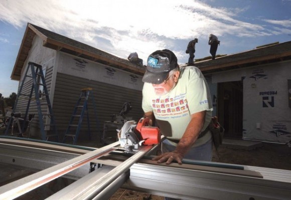 RV Habitat Care-A-Vanners pounding nails