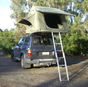 Car top tent camping = sleep safe above the mud, rocks and critters